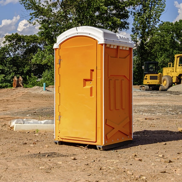 what is the cost difference between standard and deluxe portable toilet rentals in Johnson Village